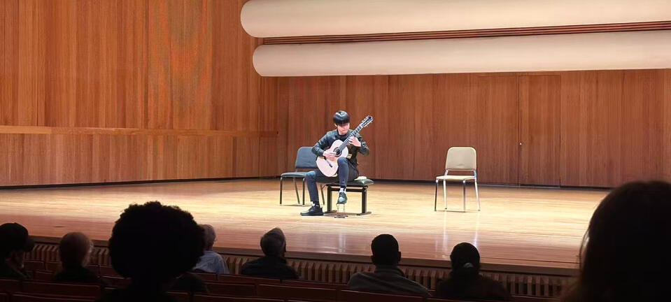Jiujiu Wu performing classical guitar at the University of Louisville Guitar Festival Competition Jiujiu Wu performing classical guitar at the University of Louisville Guitar Festival Competition