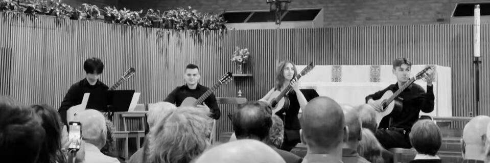 Jiujiu Wu with the New England Conservatory Guitar Ensemble performing a classical guitar quintet at the opening concert Jiujiu Wu with the New England Conservatory Guitar Ensemble performing a classical guitar quintet at the opening concert for David Russell