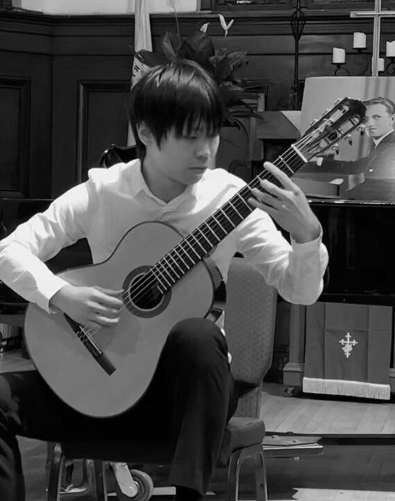 Jiujiu Wu performing classical guitar at the Gershwin International Music Competition 2023 Jiujiu Wu performing classical guitar at the Gershwin International Music Competition 2023