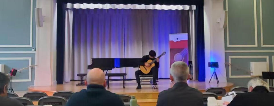 Jiujiu Wu performing classical guitar at the Philadelphia Guitar Competition Jiujiu Wu performing classical guitar at the Philadelphia Guitar Competition