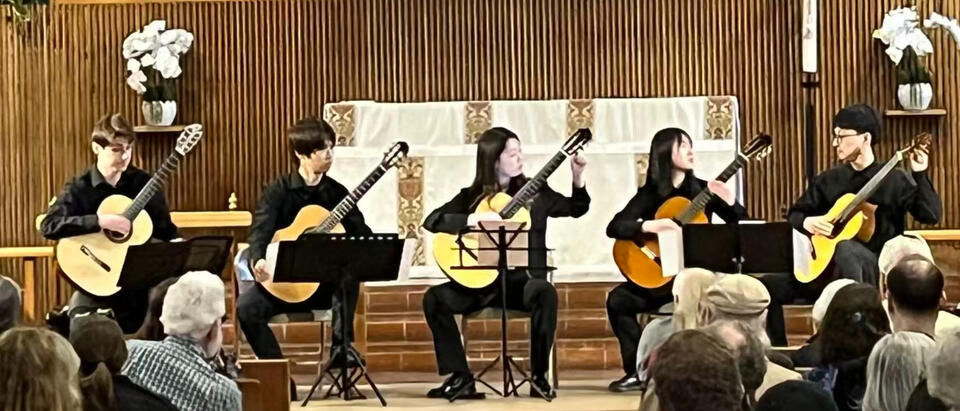 Jiujiu Wu with the New England Conservatory Guitar Ensemble performing a classical guitar quintet at the opening concert for And Jiujiu Wu with the New England Conservatory Guitar Ensemble performing a classical guitar quintet at the opening concert for Andrew York