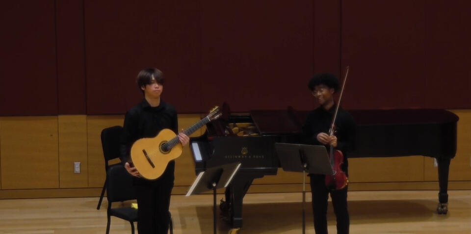 Jiujiu Wu with Sydney Scarlett Playing Guitar and Violin Chamber music at New England Conservatory Jiujiu Wu with Sydney Scarlett Playing Guitar and Violin Chamber music at New England Conservatory