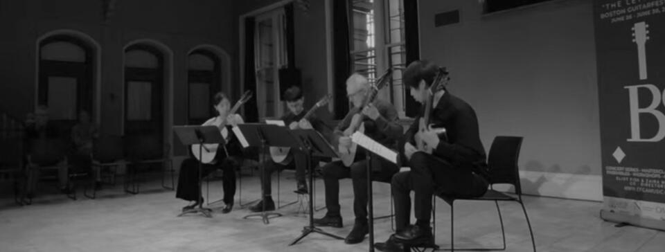Jiujiu Wu with the New England Conservatory Guitar Ensemble performing a classical guitar quartet at the Boston Guitar Fest 2024 Jiujiu Wu with the New England Conservatory Guitar Ensemble performing a classical guitar quartet at the Boston Guitar Fest 2024 Closing Ceremony with