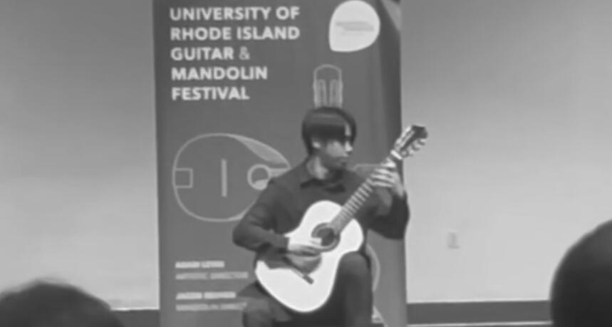 Jiujiu Wu performing classical guitar at the Rhode Island University Guitar and Mandolin Festival Competition Jiujiu Wu performing classical guitar at the Rhode Island University Guitar and Mandolin Festival Competition